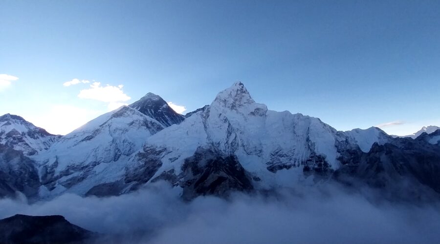 Panoramic view of Everest Base Camp featuring glaciers, rugged terrain, and majestic Himalayan vistas.